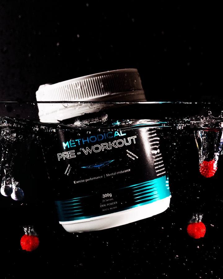 Méthodical pre-workout supplement container with water droplets on a black background
